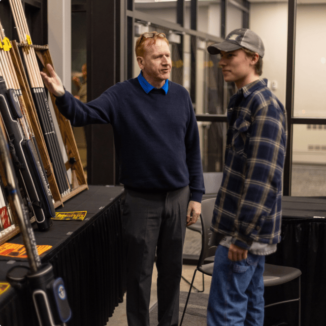 Dave showcasing a product to a customer at athe Iowa Tournament